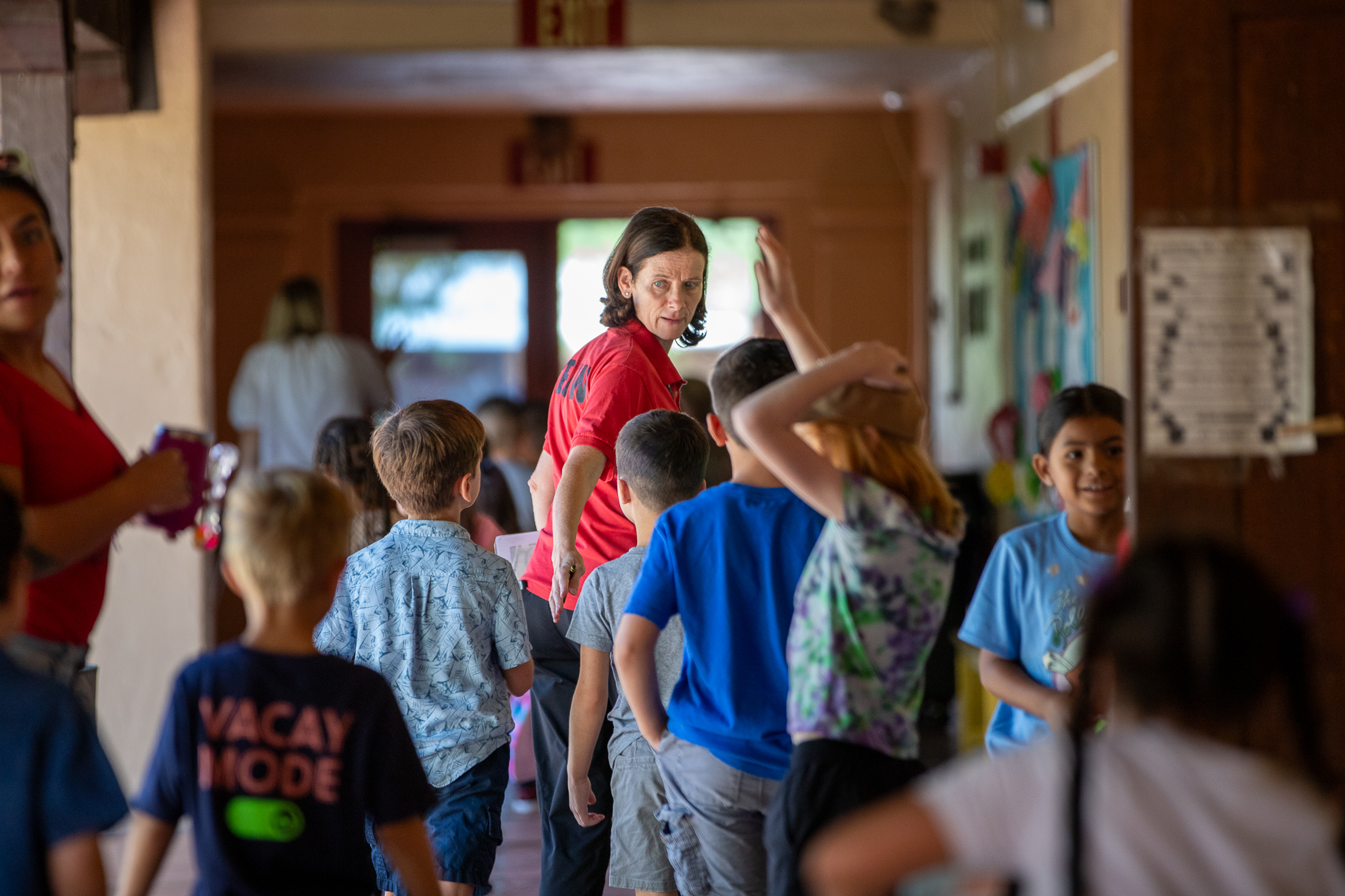 Students stand in the hallway on the first day of school