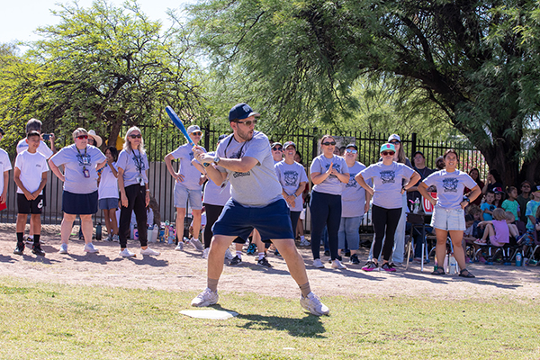 A man gets ready to swing at the softball